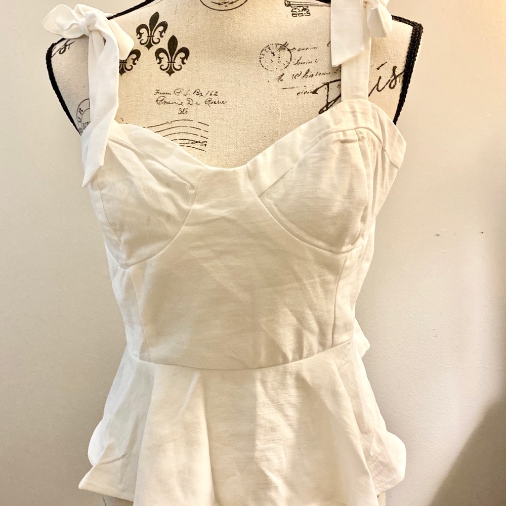 Darling white peplum top! New without tags. FOREVER 21!